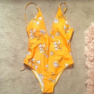 One piece swimsuit. NEVER WORN.